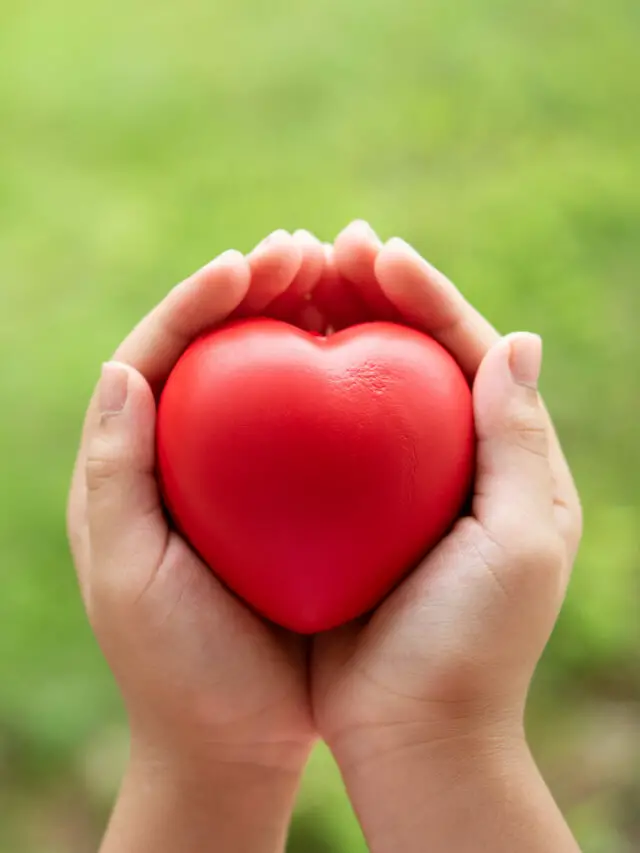 cropped-child-holding-red-rubber-heart-scaled-1.jpg